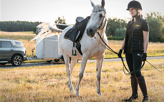 Female rider with horse