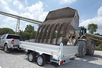 HTK Aluminium heavy-duty tipper trailer being loaded with gravel